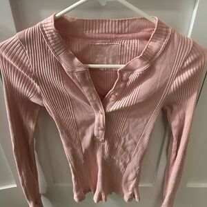 Soft pink Henley style cotton shirt w/buttons at neckline & banded wrists.